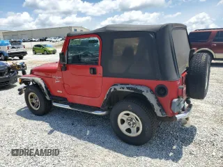 2001 Jeep Wrangler Sport with VIN 1J4FA49S51P365327, listed as a Copart auction lot 61720115 with 194,086 mi miles and Salvage title. Bid and sale history available at DreamBid. Image 2.