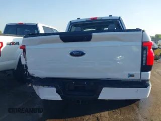 2023 Ford F-150 Lightning Pro with VIN 1FTVW1EL6PWG34059, listed as a IAAI auction lot 42010900 with 20,759 mi miles and . Bid and sale history available at DreamBid. Image 16.