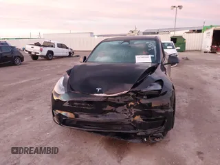 2023 Tesla Model Y Long Range z VIN 7SAYGDEE2PA166042, wystawiony jako IAAI lot #41348960 z przebiegiem Nie podano mil oraz . Historia ofert i sprzedaży dostępna na DreamBid. Obrazek 12.