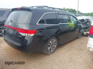 2015 Honda Odyssey Touring Elite with VIN 5FNRL5H90FB065004, listed as a IAAI auction lot 42461597 with 317,523 mi miles and . Bid and sale history available at DreamBid. Image 4.