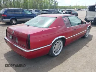 1997 Cadillac Eldorado Touring ETC z VIN 1G6ET1297VU600449, wystawiony jako IAAI lot #42096992 z przebiegiem 185 918 mil mil oraz . Historia ofert i sprzedaży dostępna na DreamBid. Obrazek 4.