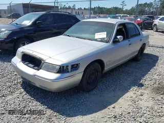 2001 Mercury Grand Marquis GS z VIN 2MEFM74W71X671429, wystawiony jako IAAI lot #41684570 z przebiegiem 155 334 mil mil oraz . Historia ofert i sprzedaży dostępna na DreamBid. Obrazek 2.