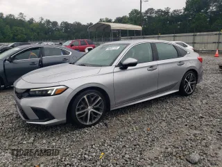 2023 Honda Civic Touring with VIN 2HGFE1F94PH313938, listed as a Copart auction lot 59091125 with 35,695 mi miles and Salvage title. Bid and sale history available at DreamBid. Image 1.