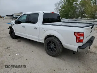 2018 Ford F-150 XL with VIN 1FTEW1C53JKC18828, listed as a Copart auction lot 50357415 with 128,689 mi miles and Salvage Title. Bid and sale history available at DreamBid. Image 2.
