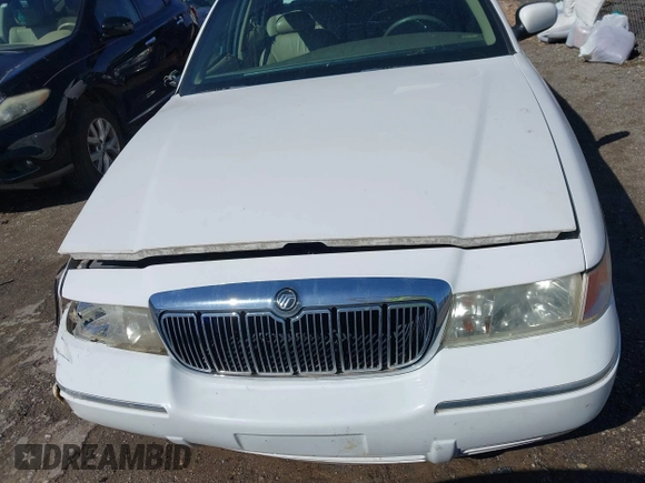 2002 Mercury Grand Marquis LS Premium z VIN 2MEFM75W92X641347, wystawiony jako IAAI lot #41701179 z przebiegiem 79 942 mil mil oraz . Historia ofert i sprzedaży dostępna na DreamBid. Obrazek 12.
