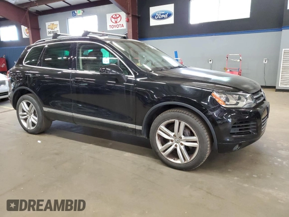 2012 Volkswagen Touareg Sport with VIN WVGEF9BP9CD011879, listed as a Copart auction lot 56903035 with 198,262 mi miles and Clean title. Bid and sale history available at DreamBid. Image 4.