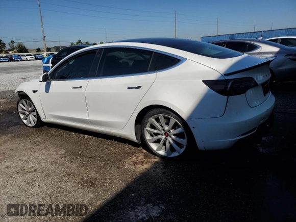 2020 Tesla Model 3 Standard Range Plus with VIN 5YJ3E1EA6LF661513, listed as a Copart auction lot 47008985 with 128,362 mi miles and Non Repairable. Bid and sale history available at DreamBid. Image 2.