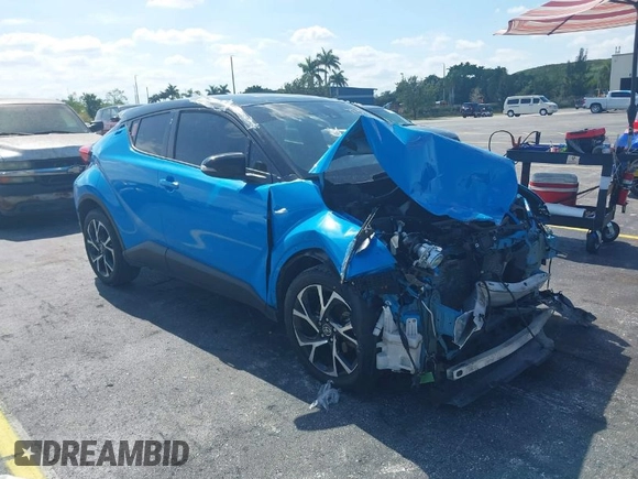 2019 Toyota C-HR XLE with VIN NMTKHMBX6KR097934, listed as a IAAI auction lot 39276687 with 56,973 mi miles. Bid and sale history available at carsss.com. Image 1.