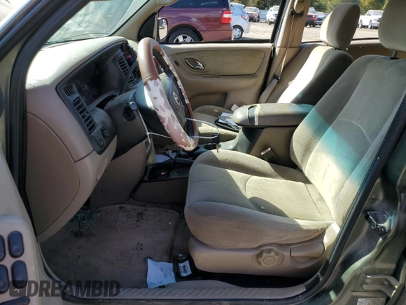 2002 Mazda Tribute LX with VIN 4F2YU09122KM62196, listed as a Copart auction lot 77327034 with 256,385 mi miles and Salvage Title. Bid and sale history available at carsss.com. Image 7.