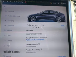 2015 Tesla Model S 85D with VIN 5YJSA1E28FF110066, listed as a IAAI auction lot 40672973 with 100,157 mi miles. Bid and sale history available at carsss.com. Image 7.