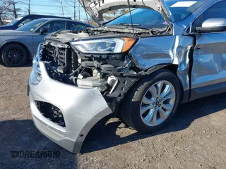 2020 Ford Edge Titanium z VIN 2FMPK4K96LBA00515, wystawiony jako IAAI lot #41757974 z przebiegiem 76 242 mil mil oraz . Historia ofert i sprzedaży dostępna na DreamBid. Obrazek 6.