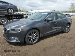 2016 Mazda 6 i Grand Touring с VIN JM1GJ1W53G1422899, выставлен на аукционе Copart как лот 55567545 с пробегом 104 701 миль миль и Списание • Salvage title. История ставок и продаж доступна на DreamBid. Изображение 1.