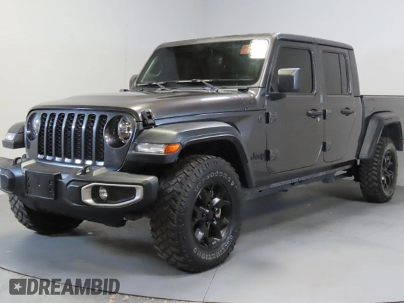 2023 Jeep Gladiator Freedom with VIN 1C6JJTAG9PL557861, listed as a Copart auction lot 56429485 with 44,716 mi miles and Salvage title. Bid and sale history available at DreamBid. Image 2.