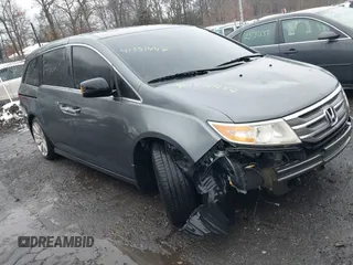 2012 Honda Odyssey Touring with VIN 5FNRL5H98CB089871, listed as a IAAI auction lot 41351447 with 999,999 mi miles. Bid and sale history available at carsss.com. Image 1.