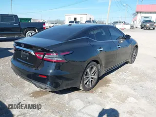 2019 Nissan Maxima Platinum z VIN 1N4AA6AV0KC365901, wystawiony jako IAAI lot #41473793 z przebiegiem 137 772 mil mil oraz . Historia ofert i sprzedaży dostępna na DreamBid. Obrazek 4.