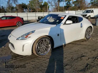 2014 Nissan 370Z Touring with VIN JN1AZ4EH8EM631324, listed as a Copart auction lot 85573524 with 0 mi miles and Salvage Title. Bid and sale history available at carsss.com. Image 1.