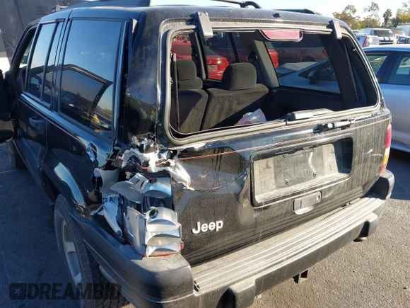 1998 Jeep Grand Cherokee Laredo with VIN 1J4FX58S8WC121904, listed as a IAAI auction lot 41145207 with 222,134 mi miles. Bid and sale history available at carsss.com. Image 6.