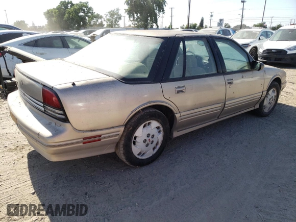 1997 Oldsmobile Cutlass Supreme S z VIN 1G3WH52M1VF353626, wystawiony jako Copart lot #63069534 z przebiegiem 62 841 mil mil oraz Szkody całkowita. Historia ofert i sprzedaży dostępna na DreamBid. Obrazek 3.