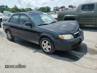 2002 Mazda Protege DX z VIN JM1BJ225020537013, wystawiony jako Copart lot #56952495 z przebiegiem 129 846 mil mil oraz Czysty tytuł • Clean title. Historia ofert i sprzedaży dostępna na DreamBid. Obrazek 13.
