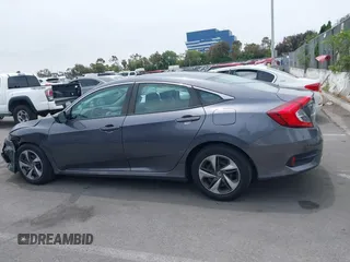 2020 Honda Civic LX z VIN 2HGFC2F60LH596396, wystawiony jako IAAI lot #42354812 z przebiegiem 62 082 mil mil oraz . Historia ofert i sprzedaży dostępna na DreamBid. Obrazek 14.