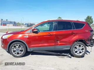 2015 Ford Escape Titanium with VIN 1FMCU9J92FUA53699, listed as a IAAI auction lot 40500310 with 197,581 mi miles. Bid and sale history available at carsss.com. Image 14.