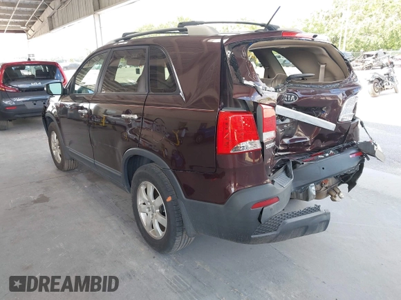 2012 Kia Sorento LX z VIN 5XYKT4A6XCG218424, wystawiony jako IAAI lot #42351646 z przebiegiem 185 016 mil mil oraz . Historia ofert i sprzedaży dostępna na DreamBid. Obrazek 3.