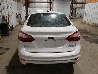 2016 Ford Fiesta Titanium z VIN 3FADP4CJ0GM167738, wystawiony jako Copart lot #57875245 z przebiegiem 159 230 mil mil oraz Czysty tytuł • Clean title. Historia ofert i sprzedaży dostępna na DreamBid. Obrazek 6.