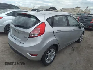 2016 Ford Fiesta SE with VIN 3FADP4EJ0GM198338, listed as a IAAI auction lot 28660870 with 68,135 mi miles. Bid and sale history available at carsss.com. Image 4.