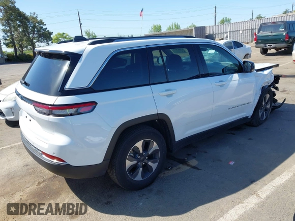 2022 Jeep Grand Cherokee with VIN 1C4RJYB66N8718018, listed as a IAAI auction lot 42002051 with Not provided miles and . Bid and sale history available at DreamBid. Image 4.