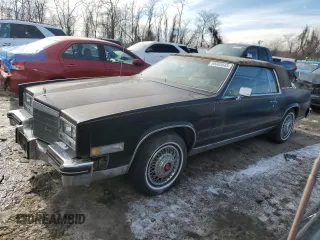 1984 Cadillac Eldorado z VIN 1G6AL5784EE626474, wystawiony jako Copart lot #89302645 z przebiegiem 23 856 mil mil oraz Czysty tytuł • Clean title. Historia ofert i sprzedaży dostępna na DreamBid. Obrazek 1.