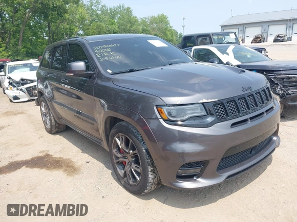 2018 Jeep Grand Cherokee SRT z VIN 1C4RJFDJ7JC281644, wystawiony jako IAAI lot #42481239 z przebiegiem 160 218 mil mil oraz . Historia ofert i sprzedaży dostępna na DreamBid. Obrazek 1.