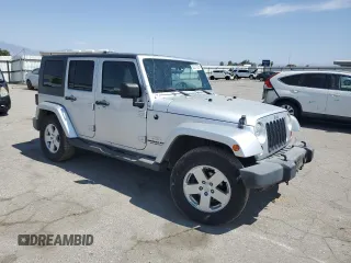2007 Jeep Wrangler Unlimited Sahara with VIN 1J8GA59137L181360, listed as a Copart auction lot 62311225 with 151,393 mi miles and Salvage title. Bid and sale history available at DreamBid. Image 4.