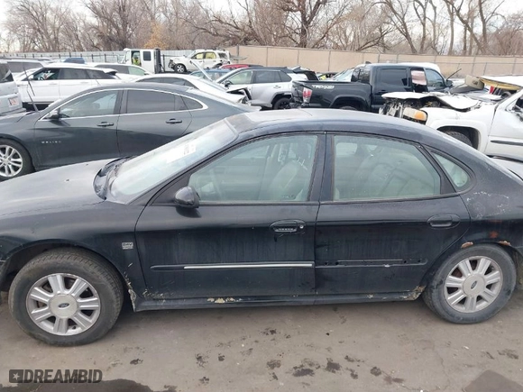2004 Ford Taurus SEL with VIN 1FAHP56S44A129658, listed as a IAAI auction lot 41381122 with 298,335 mi miles. Bid and sale history available at carsss.com. Image 14.