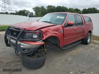 2001 Ford F-150 SuperCrew XLT with VIN 1FTRW08W01KE02928, listed as a Copart auction lot 73629704 with 313,859 mi miles and Salvage Title. Bid and sale history available at carsss.com. Image 1.