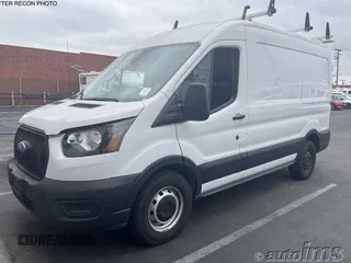 2021 Ford Transit Cargo z VIN 1FTYE1C89MKA78153, wystawiony jako IAAI lot #42835600 z przebiegiem 88 619 mil mil oraz . Historia ofert i sprzedaży dostępna na DreamBid. Obrazek 1.
