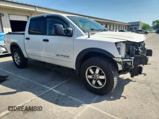 2012 Nissan Titan SL with VIN 1N6BA0EC9CN324495, listed as a Copart auction lot 60982445 with 142,430 mi miles and Salvage title. Bid and sale history available at DreamBid. Image 4.