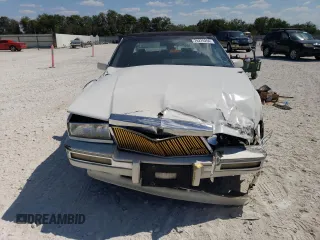 1991 Cadillac Seville z VIN 1G6KS53B9MU824142, wystawiony jako Copart lot #74276264 z przebiegiem 103 517 mil mil oraz Szkody całkowita. Historia ofert i sprzedaży dostępna na DreamBid. Obrazek 5.