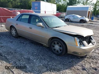 2006 Cadillac DTS 1SC z VIN 1G6KD57Y26U105889, wystawiony jako IAAI lot #42220098 z przebiegiem 104 707 mil mil oraz . Historia ofert i sprzedaży dostępna na DreamBid. Obrazek 1.