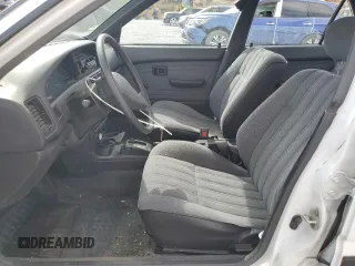 1990 Toyota Corolla z VIN 1NXAE94A0LZ089770, wystawiony jako Copart lot #75318334 z przebiegiem 161 894 mil mil oraz Szkoda całkowita • Salvage title. Historia ofert i sprzedaży dostępna na DreamBid. Obrazek 7.