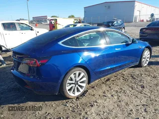 2019 Tesla Model 3 Long Range with VIN 5YJ3E1EB7KF454636, listed as a IAAI auction lot 41853972 with 56,916 mi miles. Bid and sale history available at carsss.com. Image 4.