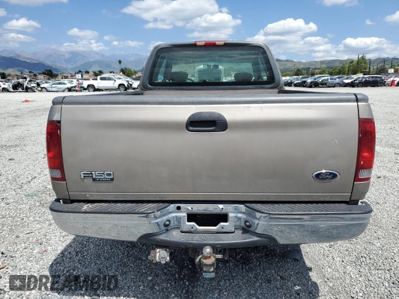 2001 Ford F-150 with VIN 1FTPX17L21NA37619, listed as a Copart auction lot 56922485 with 212,148 mi miles and Salvage title. Bid and sale history available at DreamBid. Image 6.
