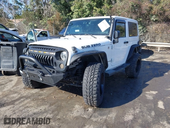 2014 Jeep Wrangler Sport with VIN 1C4AJWAG0EL245337, listed as a IAAI auction lot 41532314 with 140,721 mi miles and . Bid and sale history available at DreamBid. Image 17.