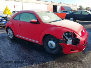 2014 Volkswagen Beetle 2.5L w/Sun with VIN 3VWJP7AT8EM629573, listed as a IAAI auction lot 41479054 with 73,950 mi miles and . Bid and sale history available at DreamBid. Image 1.