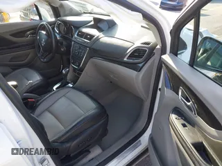 2016 Buick Encore Premium with VIN KL4CJDSB1GB647306, listed as a IAAI auction lot 41983159 with 59,592 mi miles. Bid and sale history available at carsss.com. Image 5.