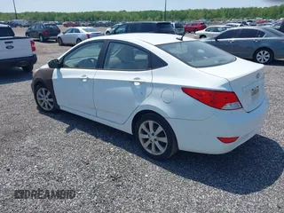 2014 Hyundai Accent GLS with VIN KMHCU4AE8EU589409, listed as a IAAI auction lot 42171087 with 209,204 mi miles. Bid and sale history available at carsss.com. Image 3.