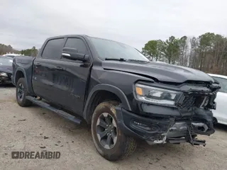 2019 Ram 1500 Rebel z VIN 1C6SRFLT1KN722064, wystawiony jako IAAI lot #41513201 z przebiegiem 113 559 mil mil oraz . Historia ofert i sprzedaży dostępna na DreamBid. Obrazek 1.