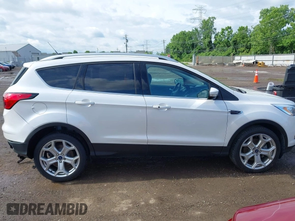 2019 Ford Escape Titanium with VIN 1FMCU9J98KUA95238, listed as a IAAI auction lot 42525324 with 59,222 mi miles and . Bid and sale history available at DreamBid. Image 13.