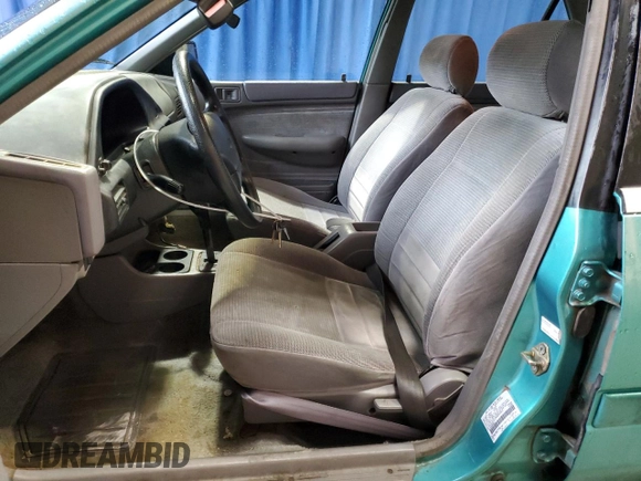 1995 Ford Escort z VIN 3FASP13J7SR205967, wystawiony jako Copart lot #73087444 z przebiegiem 100 401 mil mil oraz Szkoda całkowita • Salvage title. Historia ofert i sprzedaży dostępna na DreamBid. Obrazek 7.