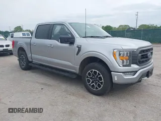 2023 Ford F-150 XL with VIN 1FTFW1E51PFB56848, listed as a IAAI auction lot 42067155 with 56,936 mi miles. Bid and sale history available at carsss.com. Image 1.