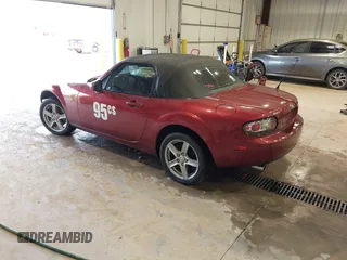 2007 Mazda MX-5 Miata Sport z VIN JM1NC25F970132299, wystawiony jako IAAI lot #41622791 z przebiegiem 72 392 mil mil oraz . Historia ofert i sprzedaży dostępna na DreamBid. Obrazek 3.